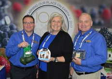 Joe Dugo, Jill Overdorf and John Heffernan with Naturipe Farms. Joe shows avocados sourced in Mexico, Jill shows the company's retail snack and John holds a clamshell with Peruvian blueberries.
